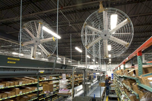Large industrial ceiling fan installed in a manufacturing warehouse